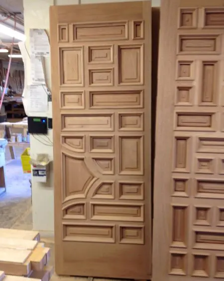 Modern wood door with subtle applied molding details